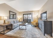 Thumbnail 10 of 32 - Living Room With TV at Whisper Hollow Apartments, Missouri, 63043