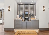 Thumbnail 42 of 52 - A reception area with a sign that says Raise your expectations at Aster Apartments, Beachwood, 44122
