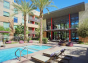 Thumbnail 14 of 48 - Relaxing Pool Area With Sundeck at Audere Apartments, Phoenix, Arizona