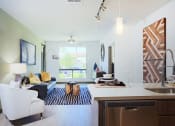Thumbnail 28 of 48 - Kitchen With Living Room at Audere Apartments, Phoenix, Arizona