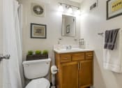 Thumbnail 23 of 28 - a bathroom with a toilet and a sink and a shower at Park 44, Missouri, 63108