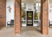 Thumbnail 2 of 28 - the entrance to a building with two benches in front of a door at Park 44, St. Louis