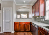 Thumbnail 23 of 51 - Kitchen With Ample Storage at Riachi at One21, Texas
