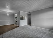 Thumbnail 15 of 44 - Carpeted Living Room at Wellington at Willow Bend, Texas
