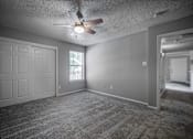 Thumbnail 18 of 44 - Carpeted Bedroom at Wellington at Willow Bend, Plano, Texas