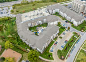 Thumbnail 61 of 63 - an aerial view of an apartment complex with a parking lot at Vanguard Crossing, St. Louis, MO