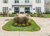 Thumbnail 60 of 63 - a flower garden in front of a building at Vanguard Crossing, St. Louis, 63124
