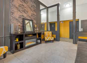 Thumbnail 24 of 28 - a living room with a couch and a fireplace at Park 44, Missouri