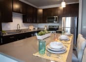 Thumbnail 4 of 27 - Gourmet Kitchen With Island at One Glenn Place, Fitchburg, Wisconsin