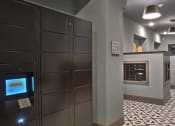 Thumbnail 5 of 40 - a lobby with a computer on the wall at Hunters Creek Apartments, Denton, 76210