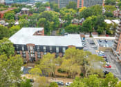 Thumbnail 28 of 28 - an aerial view of a building surrounded by trees and a parking lot at Park 44, Missouri, 63108