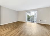 Thumbnail 20 of 28 - an empty living room with wood flooring and a window at Park 44, St. Louis, Missouri