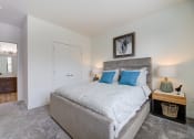 Thumbnail 17 of 36 - a bedroom with a large bed and a closet at Statesman Apartments, Wisconsin 53132
