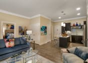 Thumbnail 20 of 52 - a living room and kitchen with a couch and a glass table at Aster Apartments, Ohio, 44122