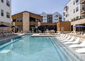 Thumbnail 9 of 22 - Resort style swimming pool with sun loungers at Timber Club Apartments, St. Peters, MO 63304