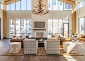 Thumbnail 1 of 22 - Spacious community clubhouse with antler chandelier at Timber Club Apartments, St. Peters, 63304