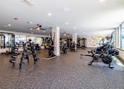 Thumbnail 5 of 22 - Spacious fitness center with cardio and weight equipment at Timber Club Apartments, St. Peters