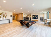 Thumbnail 4 of 22 - Recreation room with pool table and wood flooring at Timber Club Apartments, Missouri, 63304