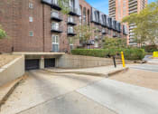 Thumbnail 11 of 28 - the entrance to a underground parking garage with a brick building at Park 44 Apartments, Missouri, 63108