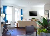 Thumbnail 19 of 63 - Living Area With TV at Vanguard Crossing, St. Louis