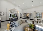 Thumbnail 4 of 44 - a living room with a couch and a table at Wellington at Willow Bend Apartments, Texas