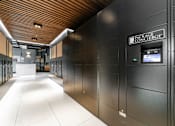 Thumbnail 8 of 29 - A long hallway with a sign that says Package Concierge.