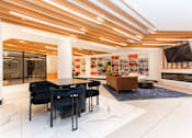 Thumbnail 9 of 37 - Community lounge with fireplace and library shelves at 1134 Fulton Street Apartments, Brooklyn, NY