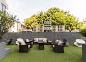Thumbnail 15 of 37 - Outdoor terrace with lounge seating and privacy fence at 1134 Fulton Street Apartments, New York, 11216