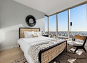 Thumbnail 29 of 56 - a bedroom with a bed and a view of the city at The Paxton, Brooklyn, 11201
