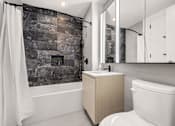 Thumbnail 40 of 56 - a bathroom with a toilet and a shower and a sink at The Paxton, Brooklyn