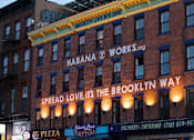 Thumbnail 47 of 56 - a building with a sign that reads spread love its the way at The Paxton, Brooklyn, NY