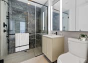 Thumbnail 39 of 56 - a bathroom with a toilet and a sink and a shower at The Paxton, Brooklyn, NY