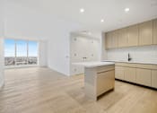 Thumbnail 37 of 56 - a living room with a kitchen and a window at The Paxton, Brooklyn, New York
