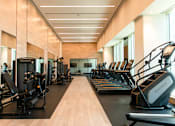 Thumbnail 14 of 56 - A gym with treadmills and exercise equipment.