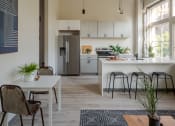 Thumbnail 2 of 42 - a small apartment with a kitchen and dining area at The 22 Apartments, Missouri, 63103