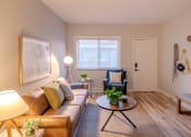 Thumbnail 4 of 11 - a living room with a couch and a coffee table