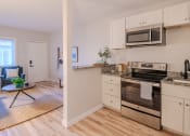 Thumbnail 6 of 11 - a kitchen with stainless steel appliances and white cabinets