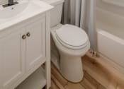 Thumbnail 10 of 11 - a bathroom with a shower and a toilet and a sink