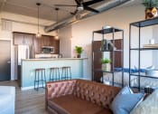 Thumbnail 24 of 42 - a kitchen and living room in a 555 waverly unit at The 22 Apartments, St. Louis, MO