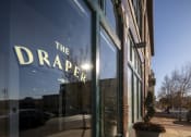 Thumbnail 26 of 28 - the drapery store front with a large glass window with the droppa sign at The Draper, St Louis, 63103