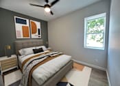 Thumbnail 16 of 50 - A bedroom with a bed, nightstand, and a ceiling fan.