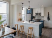 Thumbnail 23 of 29 - Fitted Kitchen With Island Dining at The Nicholas, St Louis