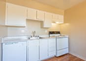 Thumbnail 22 of 22 - a kitchen with white appliances and white cabinets