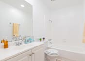 Thumbnail 13 of 25 - a bathroom with a sink and a toilet and a tub