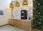Thumbnail 55 of 107 - A wall-mounted cabinet with a coffee maker on top.