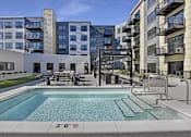 Thumbnail 10 of 107 - A swimming pool in front of a building with a height restriction sign.