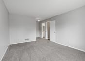 Thumbnail 7 of 13 - a spacious living room with carpet and white walls