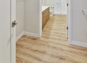 Thumbnail 91 of 107 - A white door is open to a bathroom.