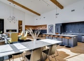 Thumbnail 14 of 24 - a kitchen and dining room with a table and chairs