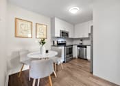 Thumbnail 22 of 53 - a kitchen and dining area in a 555 waverly unit